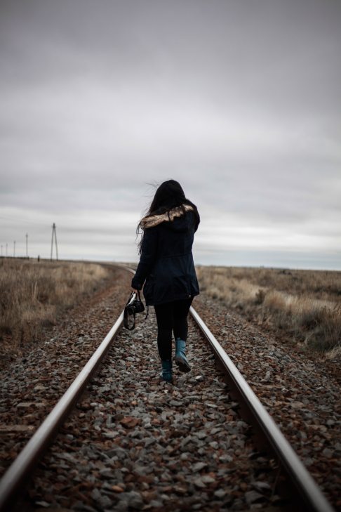 woman-walking-in-middle-of-railway-2866019